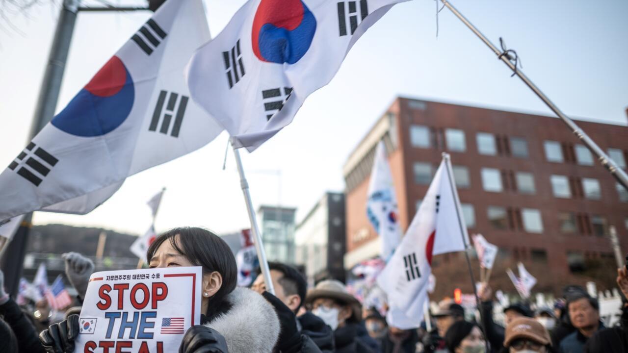 South Korea's Yoon resists arrest over martial law bid